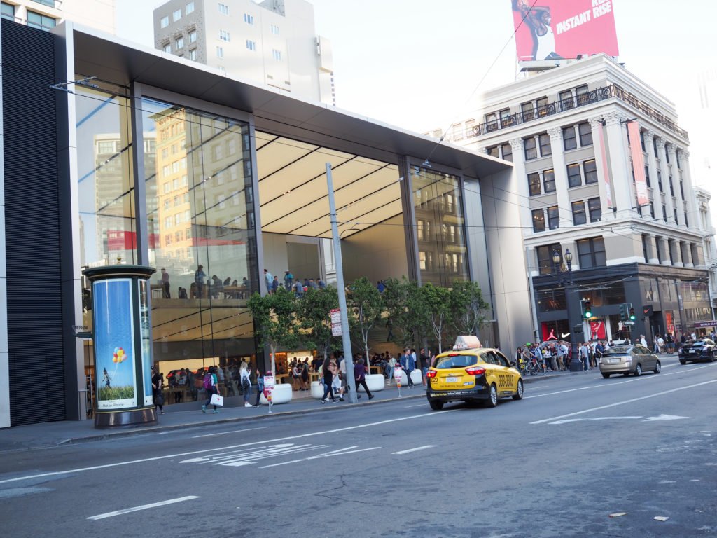 Facade of the apple store san francisco with taxi